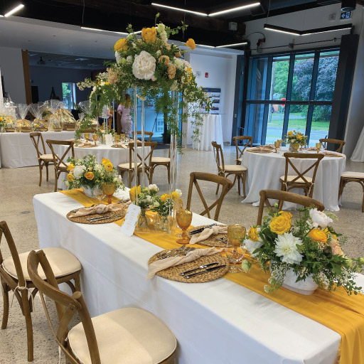 Niagara College Aurora Armoury's fine dining serving with flower pots for bridal or baby shower