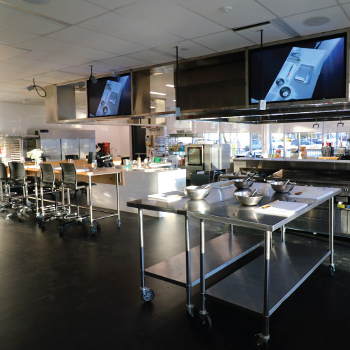 Niagara College Aurora Armoury's workshop for culinary classes with TVs and cookware