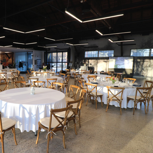 Niagara College Aurora Armoury's Mess hall with lots of tables for a big gathering with fine dining serving